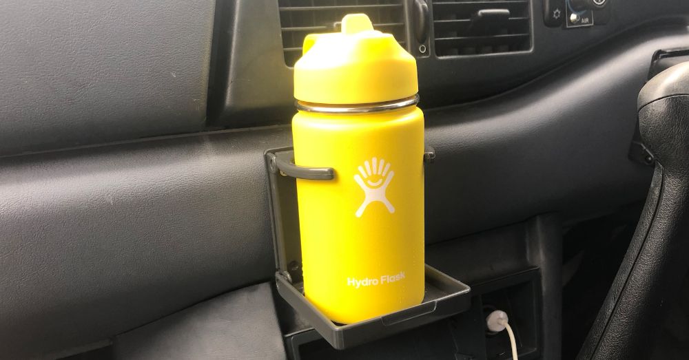 A large car cup holder, because this'll safely keep your Hydro Flask,  thermos, or other bigger bottles on-hand while driving. The days of  listening to your ther…