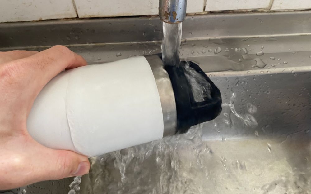 https://huntingwaterfalls.com/wp-content/uploads/2020/06/running-yeti-bottle-under-hot-water-to-open-stuck-yeti-bottle-lid.jpg