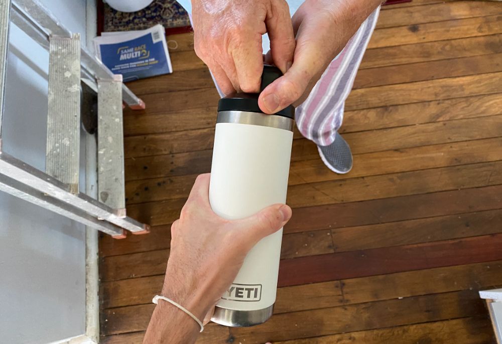 https://huntingwaterfalls.com/wp-content/uploads/2020/06/two-people-trying-to-open-stuck-yeti-bottle-lid.jpg