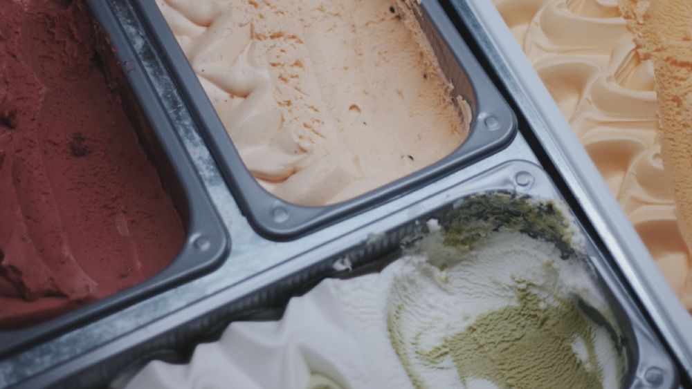 Photo of ice cream in larger stainless steel tubs