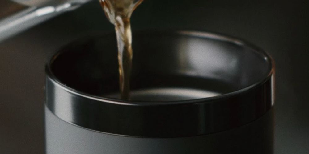 https://huntingwaterfalls.com/wp-content/uploads/2021/04/ember-travel-mug-halo-lid-pouring-coffee.jpg