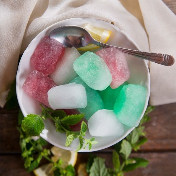 https://huntingwaterfalls.com/wp-content/uploads/2022/02/colored-ice-cubes-in-bowl-with-spoon.jpg