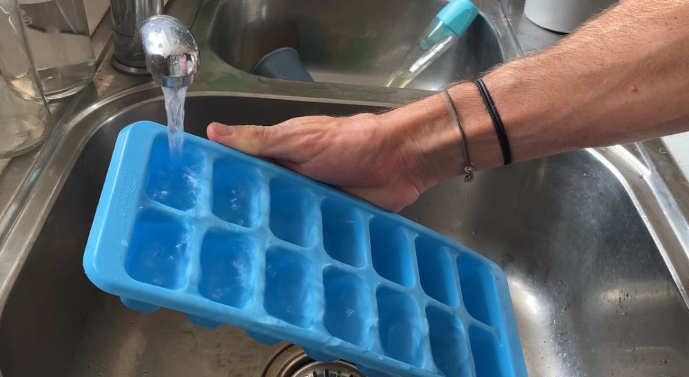 Filling Ice Cube Tray From Tap in Sink