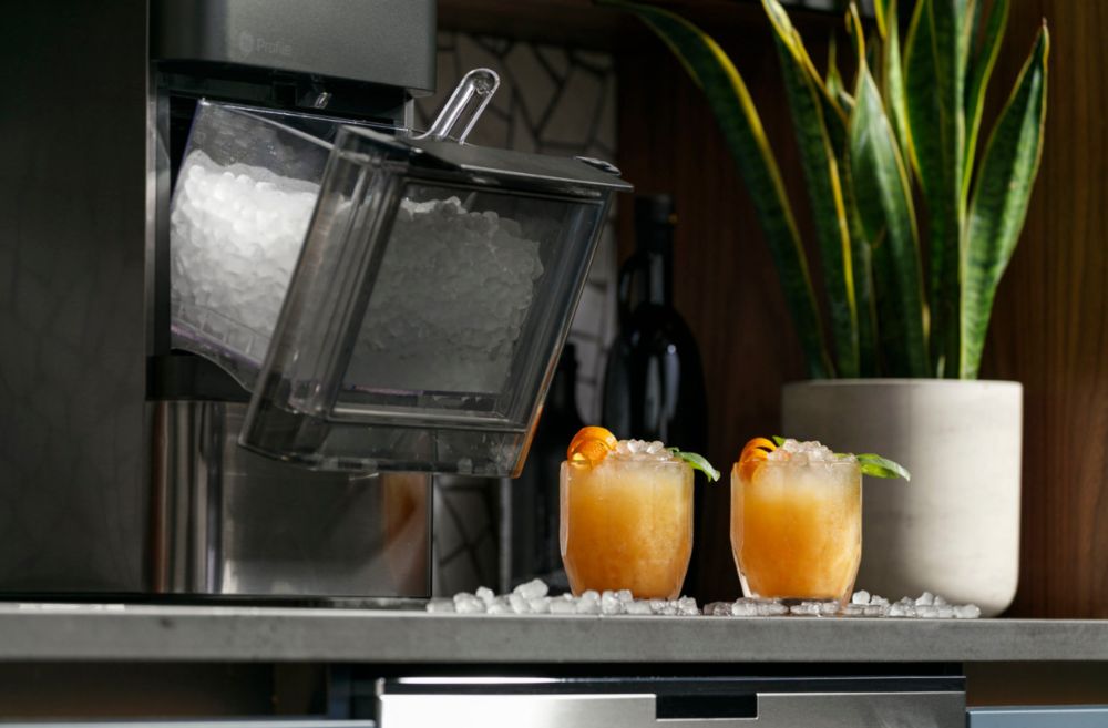 https://huntingwaterfalls.com/wp-content/uploads/2022/10/ge-profile-opal-nugget-ice-maker-2.0-tray-opan-with-cocktails.jpg