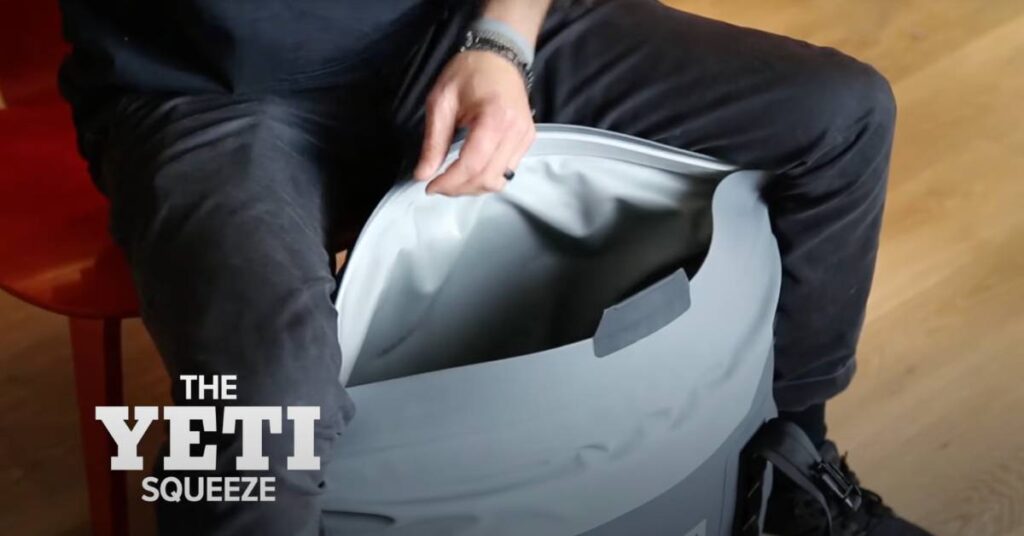 https://huntingwaterfalls.com/wp-content/uploads/2022/10/yeti-hopper-m30-soft-cooler-techniques-for-keeping-it-open-knee-squeeze-1024x536.jpg