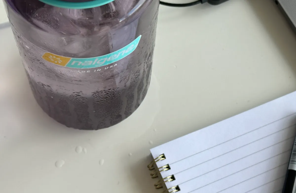 nalgenewaterbottlesweatingfilledwithiceontabletopdownwithnotebook Hunting Waterfalls
