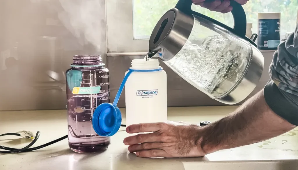 https://huntingwaterfalls.com/wp-content/uploads/2022/11/nalgene-water-bottles-pouring-boiling-water-into-ultralite-hdpe-with-tritan-plastic-next-to-it-1024x587.webp