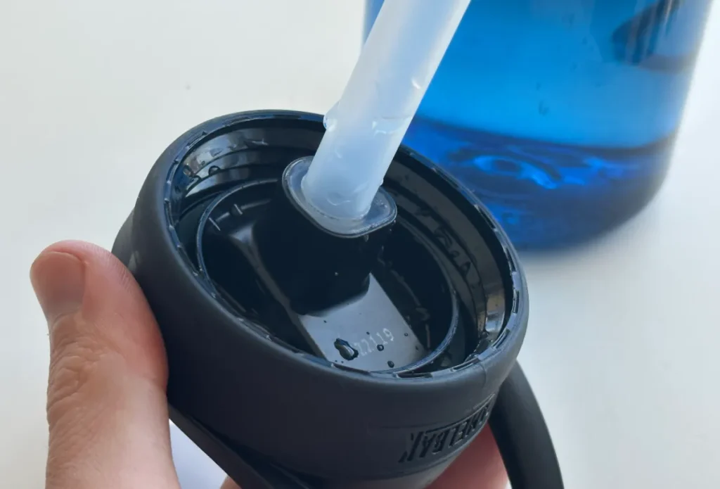 https://huntingwaterfalls.com/wp-content/uploads/2022/12/camelbak-eddy-bite-valve-cap-lid-straw-underneath-1024x695.webp