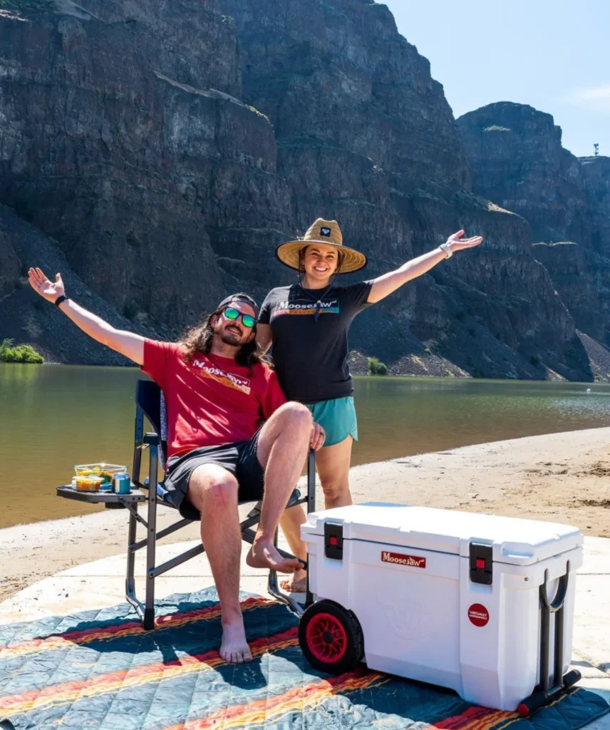 https://huntingwaterfalls.com/wp-content/uploads/2023/08/moosejaw-coolers-couple-at-river-856x1024.webp